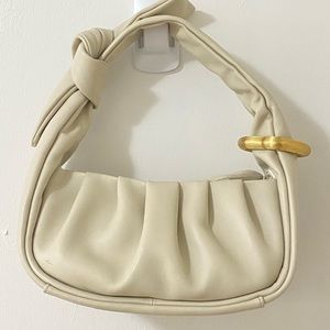Excellent condition, good for cute outfit. Creamy white bag.